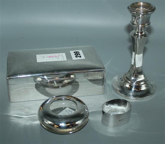 Silver cigarette box, silver candlestick, silver napkin ring and mounted tidy